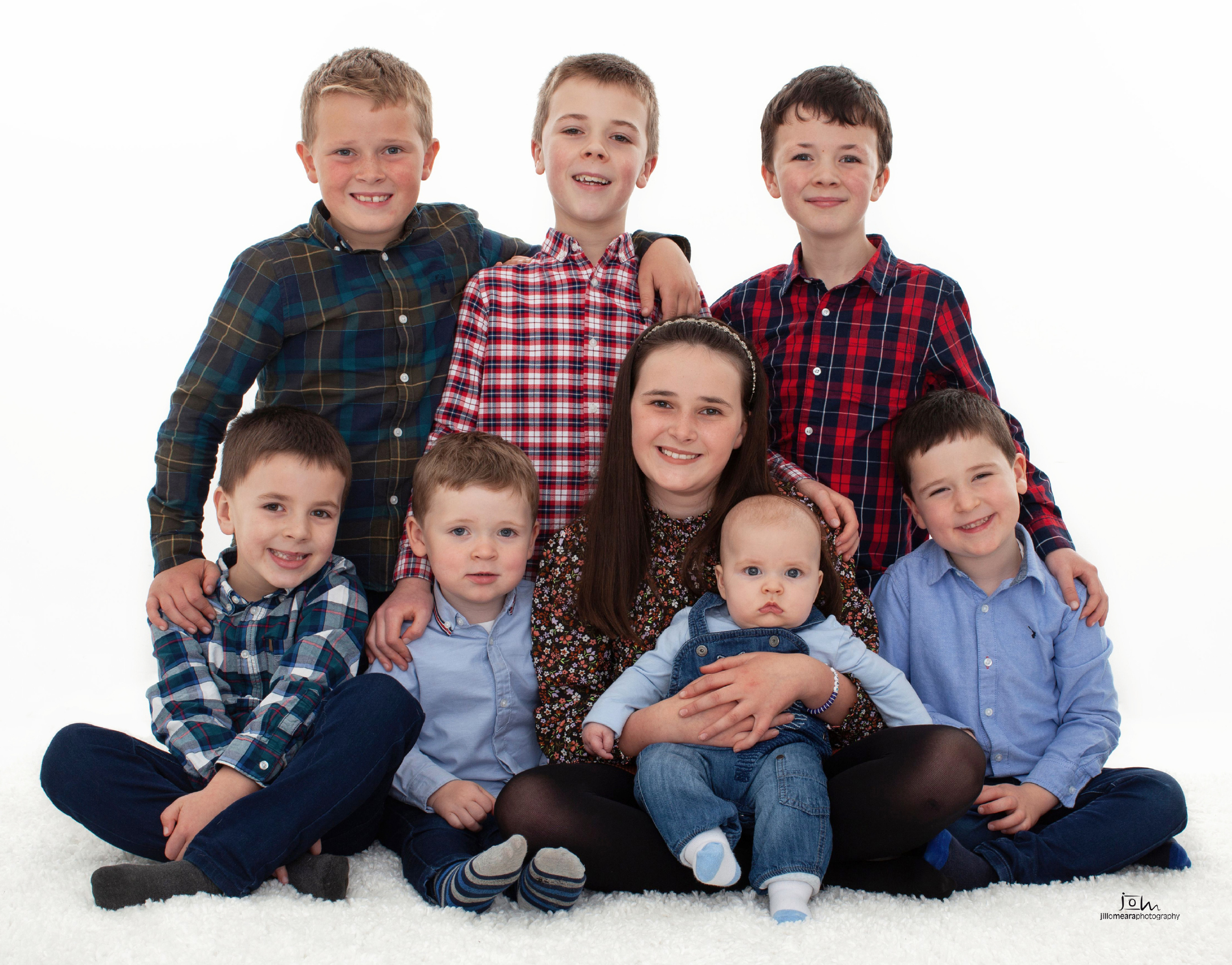 All the cousins, extended family studio portrait by Jill O'Meara